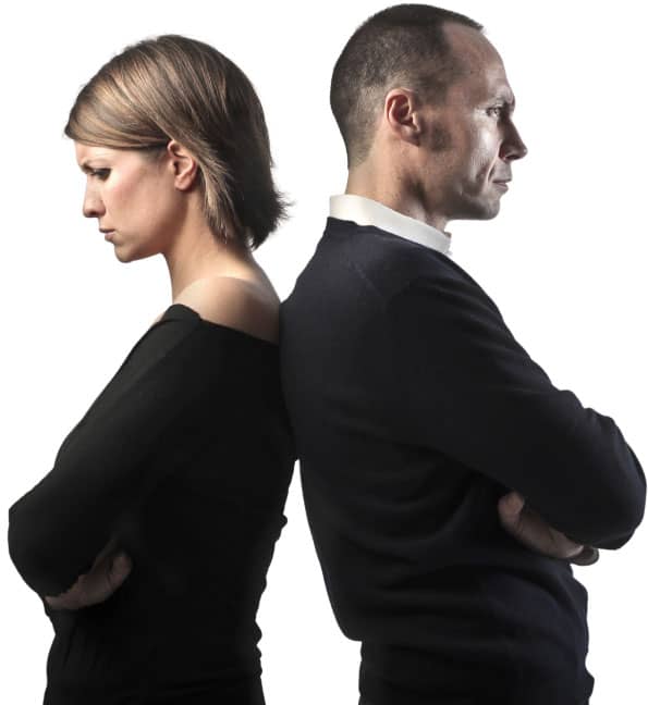 couple undergoing divorce mediation standing back-to-back